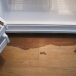 Почему под холодильником вода